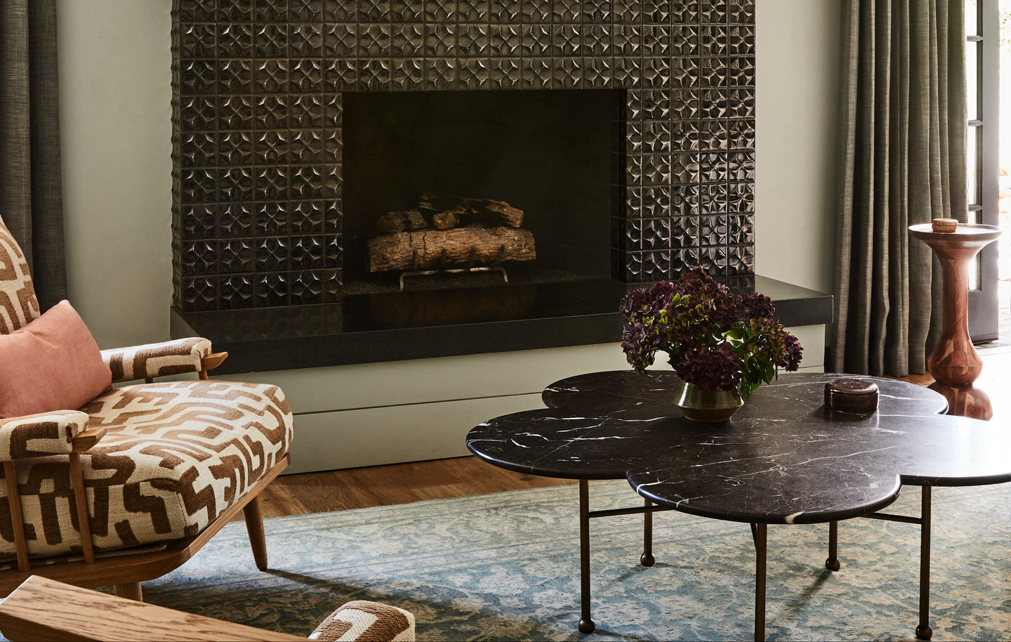August Abode's marble coffee table in the living room of Lauren Morelli and Samira Wiley